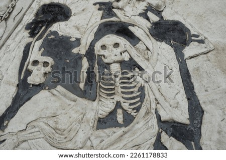 an ancient relief of a dancing death