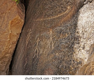 Ancient rock carvings petroglyphs of people with boat in Gobustan National park. Exposition of Petroglyphs in Gobustan near Baku, Azerbaijan.                       