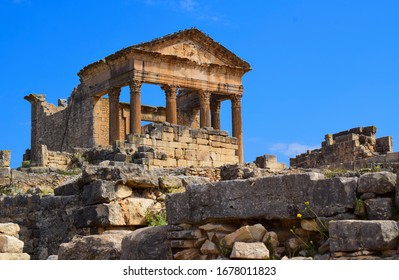 Ancient Roman Archaeological Site Of Dougga
The Capitol Is A Roman Temple From The 2nd Century CE, Dedicated To Rome's Protective Triad: Jupiter Optimus  Maximus,Juno Regina And Minerva Augusta.