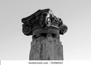 Ancient roman greek column with broken chapiter. Pompeii, Italy. Black and white photo. Copy space
