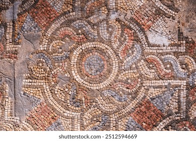 Ancient Roman mosaic floor detail in Bursa, Turkey, showcasing intricate geometric patterns and vibrant colors