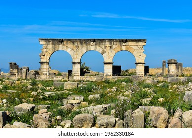 Ancient Roman ruins in the middle of an Arab country in Africa. A perfect example of an archway on the avenues of the cities of the Roman Empire