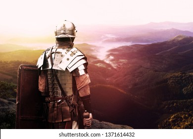 Ancient Roman Soldier Is Watching The Valley At Sunset