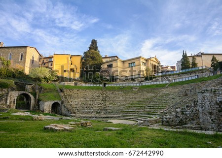 Ancient Roman theater near the ruins of Roman baths in the archaeological zone of the city of Fiesole. Tuscany. Italy