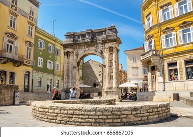 Ancient Roman triumphal arch or Golden Gate and square in Pula, Croatia, Europe