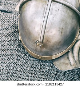 Ancient Roman Vintage Soldier Helmet And Chain Mail, Armor To Protect The Head In Battle. Reconstruction Of Military Events During The Wars Of The Roman Empire