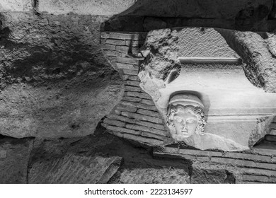 An Ancient Roman Wall, With A Detail Of A Human Head