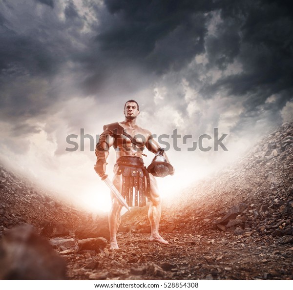 ancient Rome gladiator\
Hoplomachus warrior with sword and helmet posing on epic background\
dramatic landscape