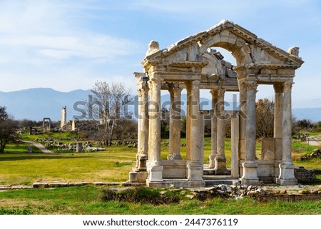 Ancient ruined construction of monumental gate of small Greek city of Aphrodisias in classical architectural form of tetrapylon located in modern Aydin Province, Turkey