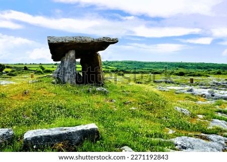 Ancient ruined tomb, Poulnabrone Dolmen in the Burren landscape of County Clare, Ireland