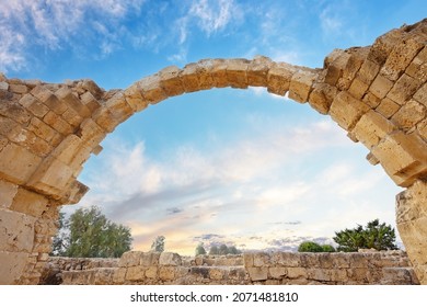 Ancient ruins of the city of Kourion near Paphos and Limassol, Cyprus. Arch of Santa Colones castle with blue sky