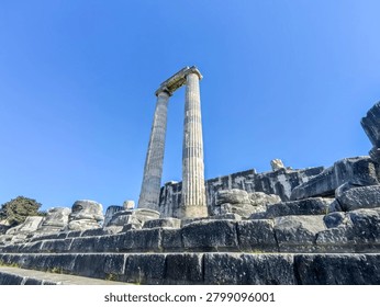 Ancient ruins and massive ionic columns of the Hellenistic Temple of Apollo at the sanctuary of Didyma in Turkey.