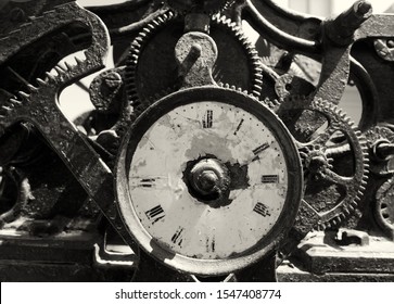 Ancient Rusty Broken Iron Clock With Weathered Face And Exposed Complex Mechanism Of Cogs And Gears