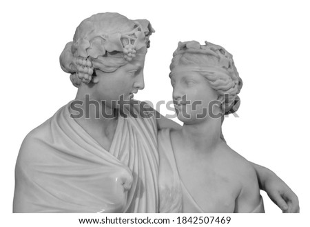 Ancient sculpture of Bacchus and Ariadne. Marble man and woman statue isolated on white background.
