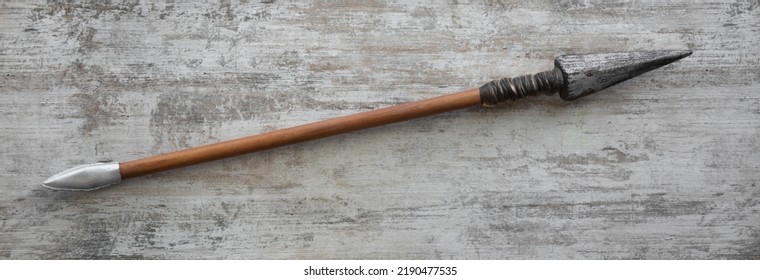 Ancient Spear On White Wooden Background