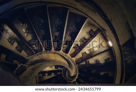 Ancient spiral staircase. Dark and gloomy.