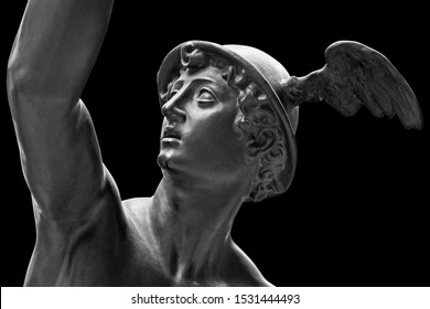 Ancient statue of the antique god of commerce, merchants and travelers Hermes - Mercury. He is olympic gods messenger with wings on a helmet. Sculpture isolated on black background by clipping path