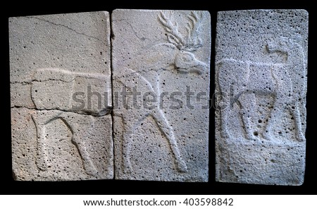 Ancient stone bas-reliefs with deer of late Hittite period on the black background Stock photo © 