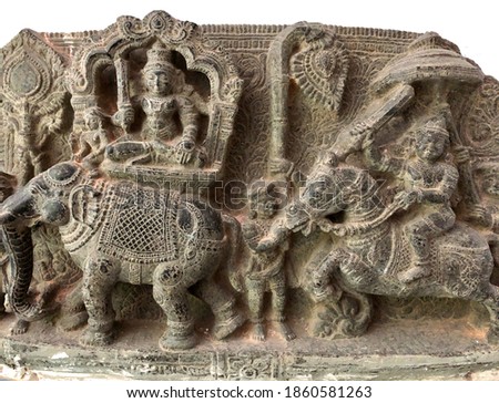 Ancient stone relief carvings of Hindu God monolithic sculpture carved on the historical temples at Tamilnadu. Bas relief ancient relief carvings of historical stone sculptures in Hindu temple.