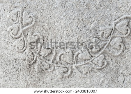 Ancient stone relief showcasing intricate vine scroll patterns, typical of classical Greco-Roman art, emphasizing a timeless aesthetic. Close up. Kaiseri, Cappadocia, Turkiye (Turkey)