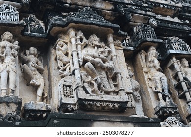 An ancient stone sculpture featuring a weathered, intricately carved figure with a serene expression, showcasing the artistry of a bygone era. - Powered by Shutterstock