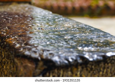 An Ancient Stone Slab That Was Wet On A Rainy Day