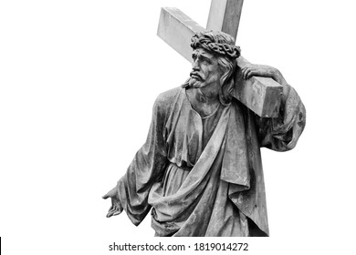 Ancient stone statue of Jesus Christ with cross isolated on white background. Free copy space.