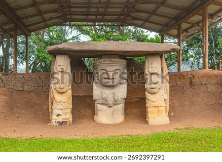 Ancient stone statues and monolithic structure at the archaeological park of San Agustin, Huila, Colombia. UNESCO World Heritage site showcasing pre-Columbian art.