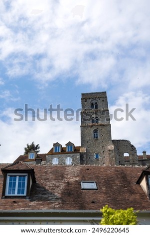 Ancient Stone Tower Overlooking Rooftops in Chateau Landon