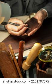 The Ancient Technique Of Etching. Engraving Of The Plate. Craftsman At Work.