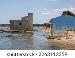 Ancient tonnara and sveva tower in the Vendicari Nature Reserve wildlife oasis, located between Noto and Marzamemi, Sicily, Italy.