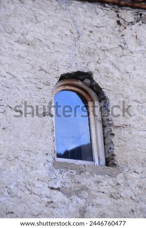 Ancient tower and oval window