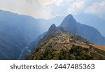 An ancient town built by the Inca tribe, nowdays called "Machu picchu" site, surrounded by mountains at the bottom of which runs the famous Urubamba River.