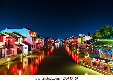 Ancient Town With Grand Canal Of Yangtze River Delta At Night In Wuxi City,China