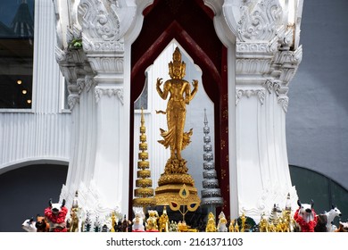 Ancient trimurti god statue or lord supreme trinity figure in shrine for thai people traveler travel visit and respect praying blessing holy on patio of central world at Pathumwan in Bangkok, Thailand