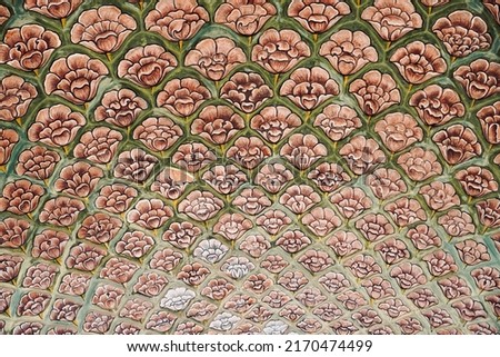 Ancient wall painting of floral pattern in City palace at Jaipur, India. Historical Indian art of textured background.