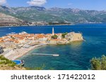 Ancient walls and tiled roof of old town Budva, Montenegro, Europe. Budva - one of the best preserved medieval cities in the Mediterranean.