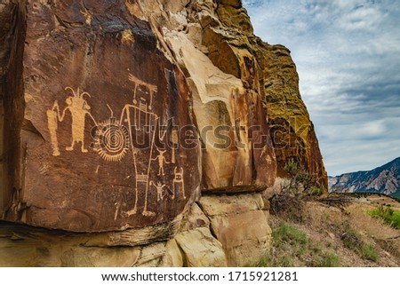 Ancient Warrior and anthropomorphic petroglyphs made by the Fremont people at McKee Springs inside Dinosaur National Monument, near the town of Jensen and the Utah-Colorado border, United States.