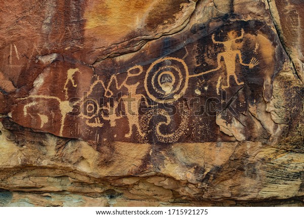 Ancient Warrior and anthropomorphic petroglyphs\
made by the Fremont people at McKee Springs inside Dinosaur\
National Monument, near the town of Jensen and the Utah-Colorado\
border, United States.