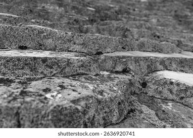 Ancient weathered stone steps showcasing the rough texture and intricate natural patterns formed over time.