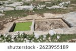 ancient wine press workshop from Roman Era located in the ruins of Sakizlik, in the Saglikli neighborhood of Tarsus, Mersin. A rectangular collection basin.