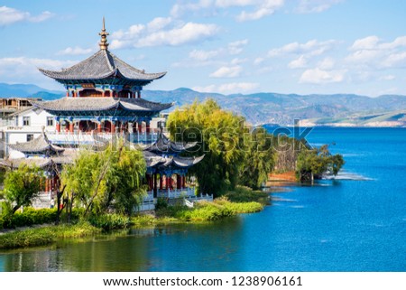 The ancient wooden Buddhist Temple on the lakeside of Erhai lake in Dali town, Yunnan province, China. Translation is 