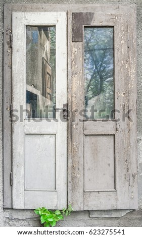 Similar – Rusty window with flower pots