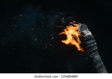 ancient wooden torch isolated on black background