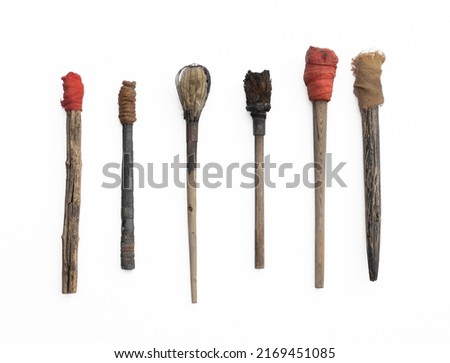 ancient wooden torches isolated on white background