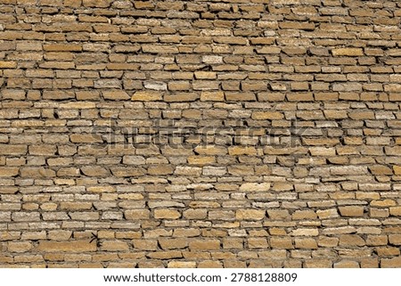 Ancient Yellow Brick Wall Texture of Medieval Fortress