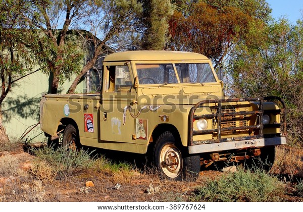 ANDAMOOKA, SOUTH AUSTRALIA -\
November 11. An old rustic  pickup truck with an advertisement sign\
of Carlton Mid beer on November 11, 2015 in opal mining town\
Andamooka.
