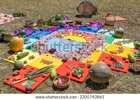 Andean cross, Chakana or Ceremony in homage to Pachamama (Mother Earth) - is an aboriginal ritual of the indigenous peoples of the central Andes. Cross made from plants, food, seeds. Ecuador, Cuenca