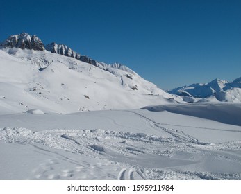 Andermatt Ski Slopes With Blue Sky, Switzerland