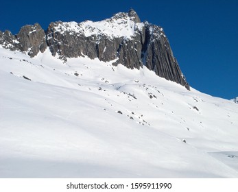 Andermatt Ski Slopes With Blue Sky, Switzerland